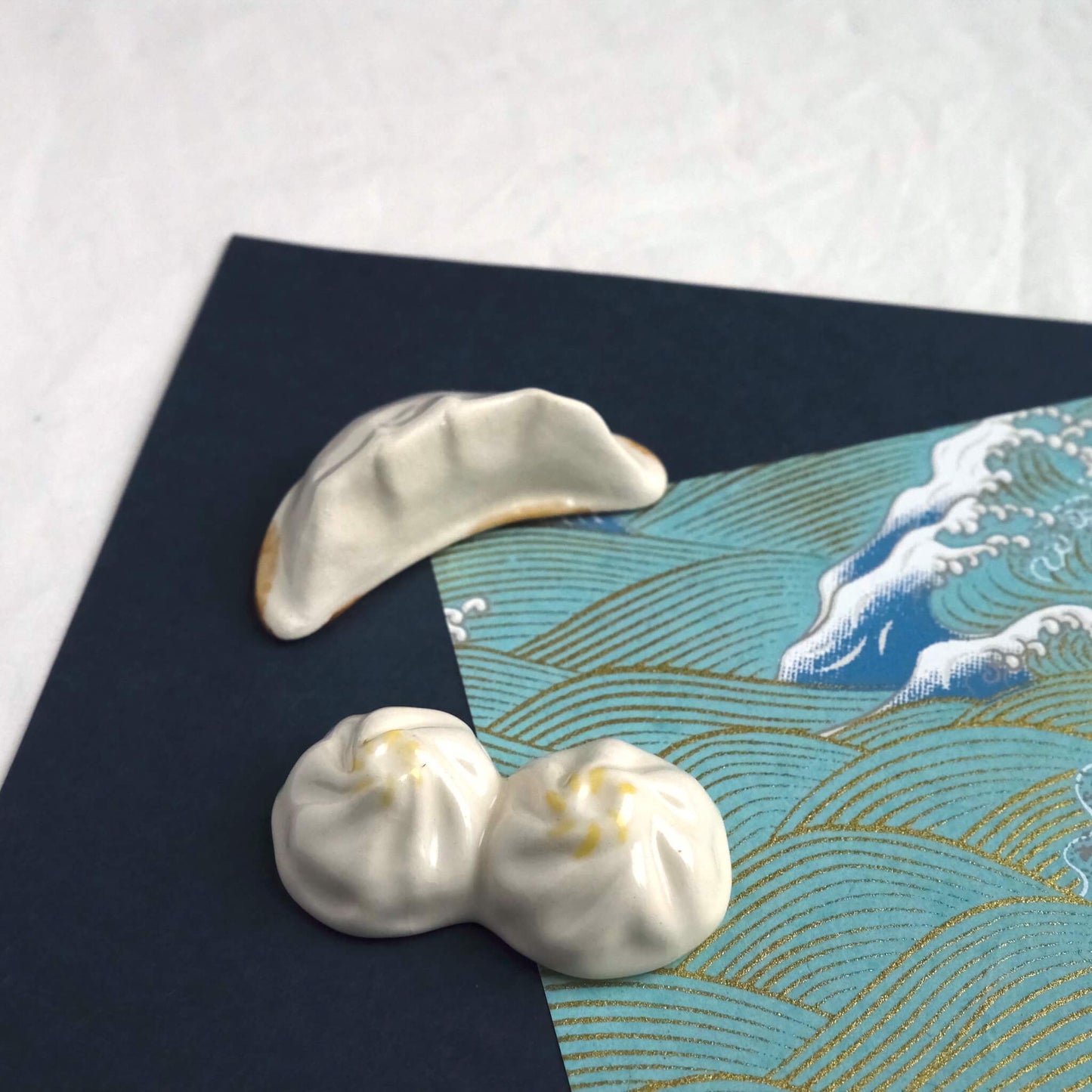 Top View of a Collection of dumpling chopstick holders: gyoza dumpling and xiaolongbao.