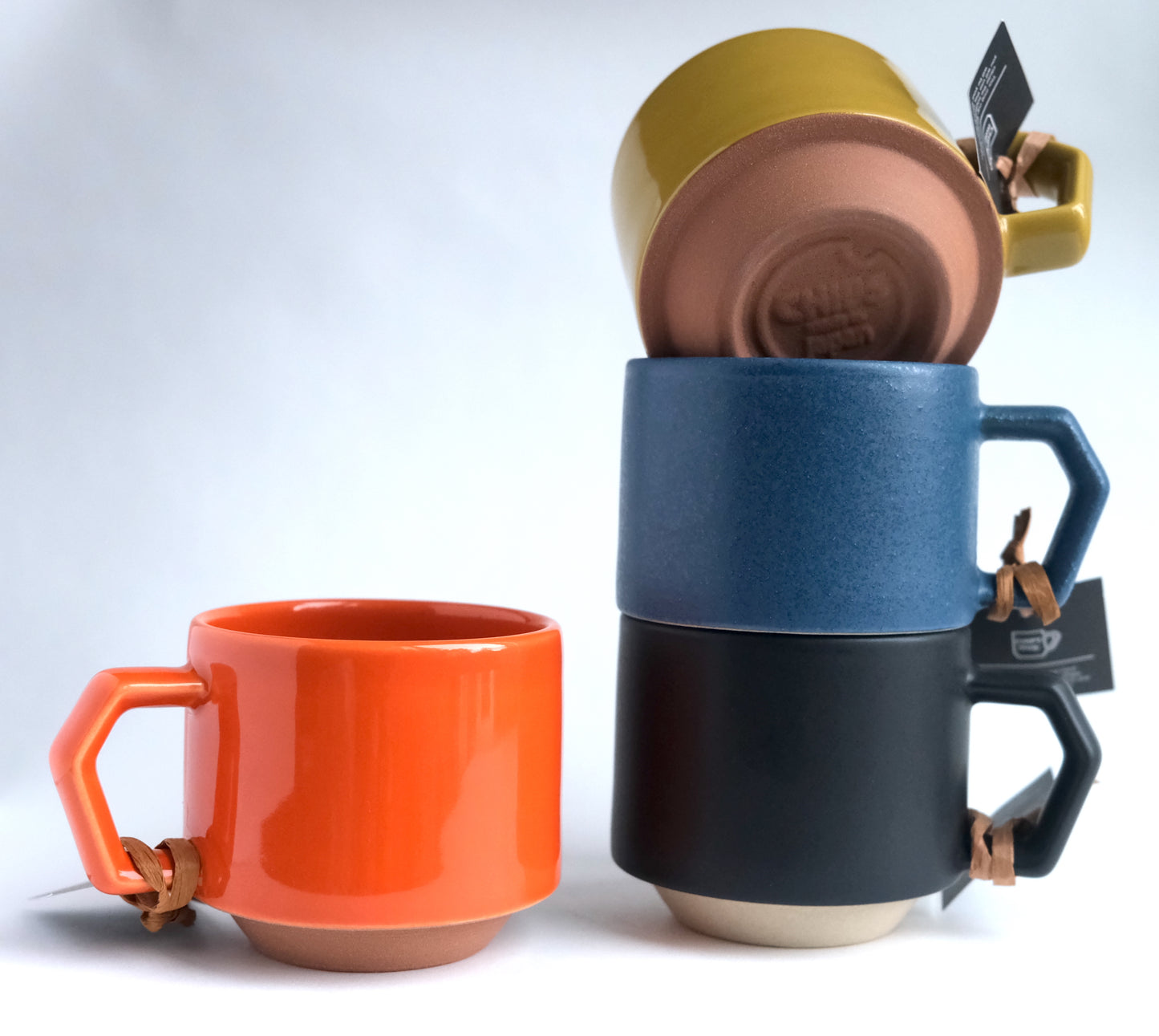 Collection of Japan stackable Chips mugs stacked together.