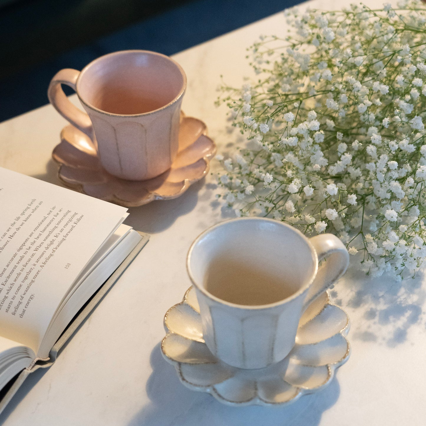 Top view of a pair of white and pink Rinka Mugs with Saucers by Kaneko Kohyo, showcasing its elegant ceramic craftsmanship and signature design.