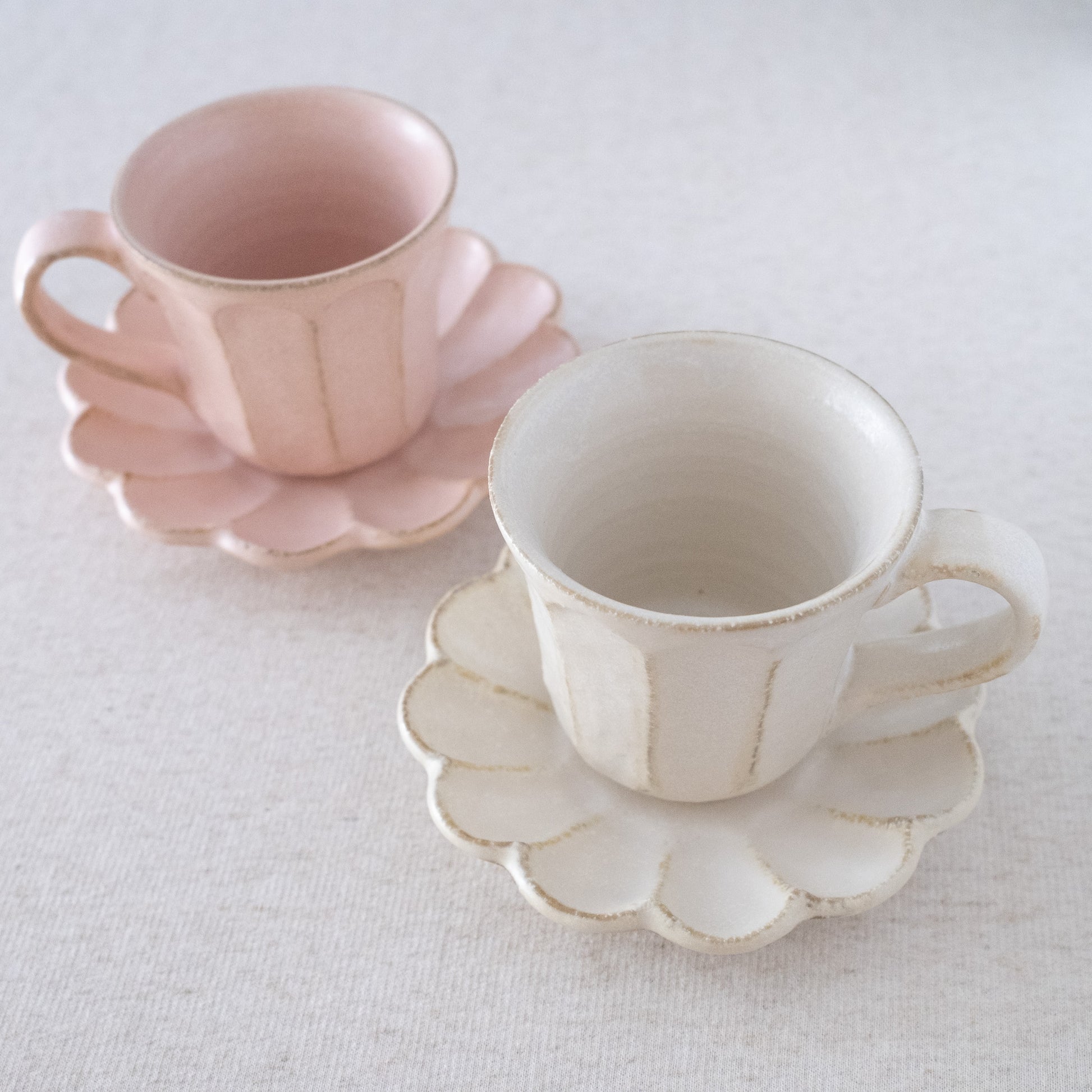 Elegant handcrafted coffee mugs with saucers made in Japan - Pink and White set